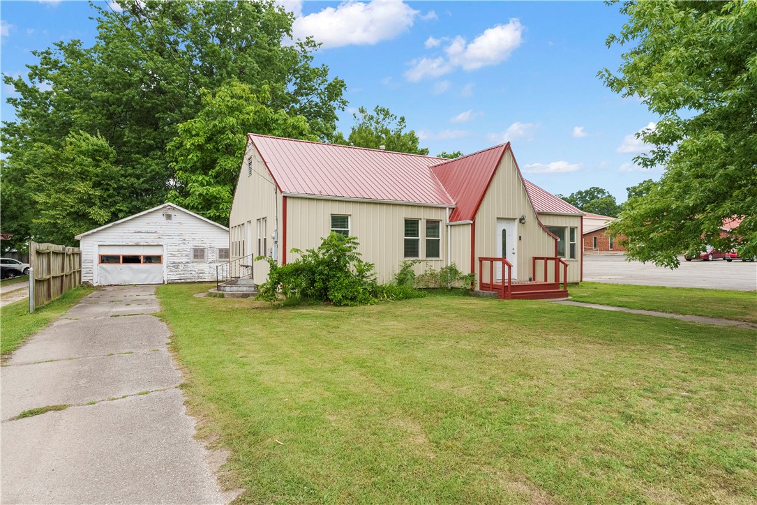 Recently remodeled home in the middle of PG. This house was originally in a subdivision, but now is completely surrounded by commercial properties. Located in the heart of Prairie Grove, this little oasis is perfect to a small family, starter home or even investment property. New parcel is approximately .21 acres.