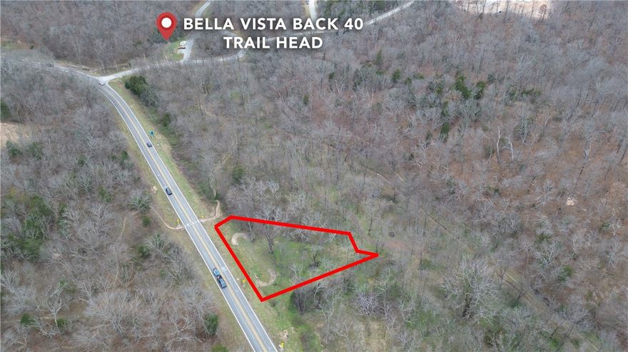 Build your dream home on this .35-acre lot in Bella Vista, perfectly positioned for privacy and outdoor living. The property has only one neighboring lot, with POA-protected woods on the remaining sides, creating a peaceful, natural setting with long-term privacy.
Enjoy walking or biking distance to the Back 40 Trailhead and direct access to the SBAT mountain bike trail, making this an ideal location for cycling, hiking, and nature lovers. Tucked away yet conveniently located, this lot offers the best of Bella Vista living—quiet surroundings, scenic views, and world-class trail access right outside your door.