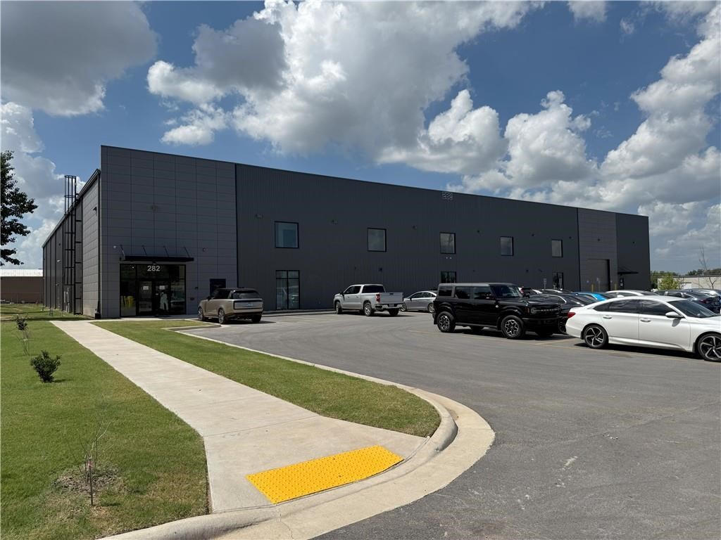 For Sale and Lease-33,000+ SF Warehouse/ Office at 282 W Hudson Rd Rogers. Built in 2024, this like-new facility offers approx. 28,000 SF warehouse and two story 5,000+ SF office space. Modern design with high ceilings 22' at the walls 25 ' at the center. bright LED lighting, polished concrete floors. Grade level overhead doors and a truck dock. Large open office space most utilized as conference or cubicles now. Large break room in warehouse. Ample paved parking and excellent truck access. Located in prime Rogers industrial corridor with easy access to I-49 and major regional routes.