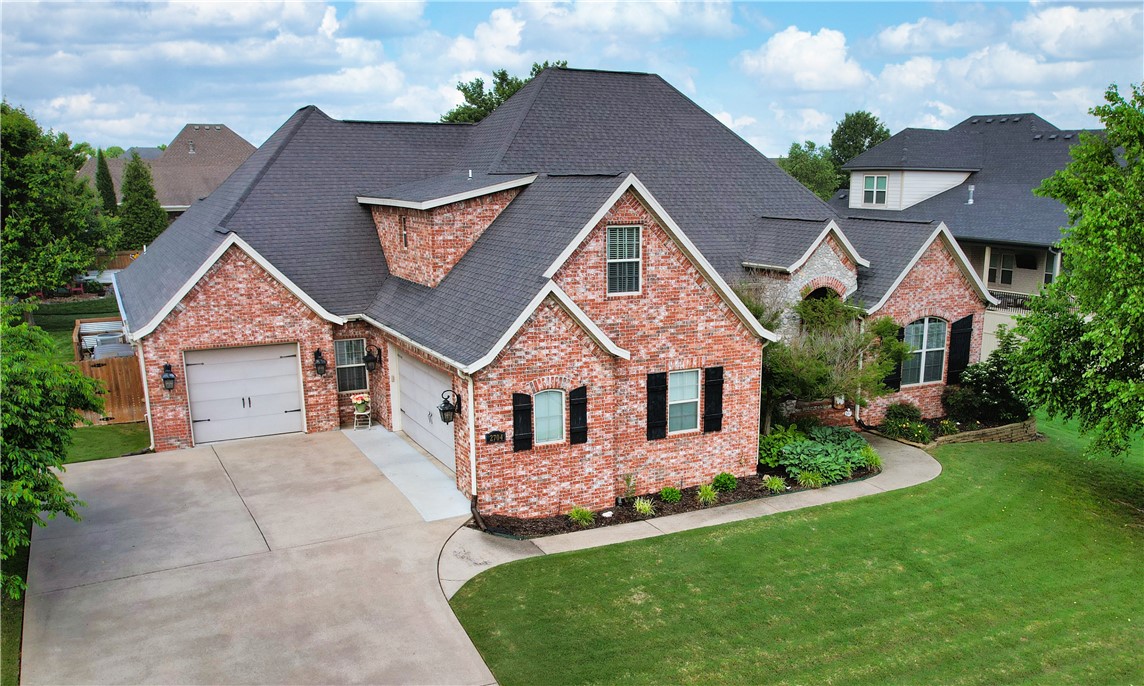 Fantastic floor plan in a prime Rogers location near the Promenade Mall, Pleasant Grove, shopping, dining, and entertainment! Located in a gated community, this 4 bed, 5.5 bath home features two spacious living areas, a dedicated office, bonus room, and beautiful hardwood floors. The large kitchen offers granite countertops, custom cabinetry, and a center island—perfect for gathering. Step outside to your private backyard oasis with a heated saltwater fiberglass pool, waterfall feature, and covered patio with outdoor fireplace. The current owners created a true retreat ideal for relaxing or entertaining. A rare find that blends comfort, convenience, and luxury! SHOWINGS BEGIN Thursday, June 5th.