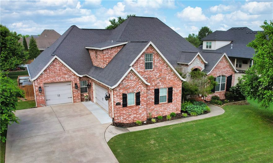 Fantastic floor plan in a prime Rogers location near the Promenade Mall, Pleasant Grove, shopping, dining, and entertainment! Located in a gated community, this 4 bed, 5.5 bath home features two spacious living areas, a dedicated office, bonus room, and beautiful hardwood floors. The large kitchen offers granite countertops, custom cabinetry, and a center island—perfect for gathering. Step outside to your private backyard oasis with a heated saltwater fiberglass pool, waterfall feature, and covered patio with outdoor fireplace. The current owners created a true retreat ideal for relaxing or entertaining. A rare find that blends comfort, convenience, and luxury!  SHOWINGS BEGIN Thursday, June 5th.