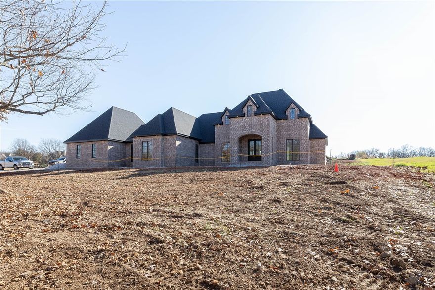 If you have been desiring a new home but don't want to go through the building process here is your chance! This beautiful, custom built home by Legend Builders is nearing completion in West Springdale! The home offers 4,420 heated sq ft which includes 5 bedrooms, 5 full bathrooms, open kitchen to living, study, sitting room, bonus room, mudd room, and separate laundry room. 4 of the 5 bedrooms are on the main level! Home is situated on 1.78 private acres. The amenities are outstanding and include a quartz waterfall island, white oak wrapped beams, black floor to ceiling windows, the most amazing tile work in all of the bathrooms that you have ever seen, 48” gas range, a dry bar, butler’s pantry, pot filler, wood burning fireplace, hardwood floors, a beautiful covered back patio, and an oversized 3 car garage!!! Zoned for Harber High School.