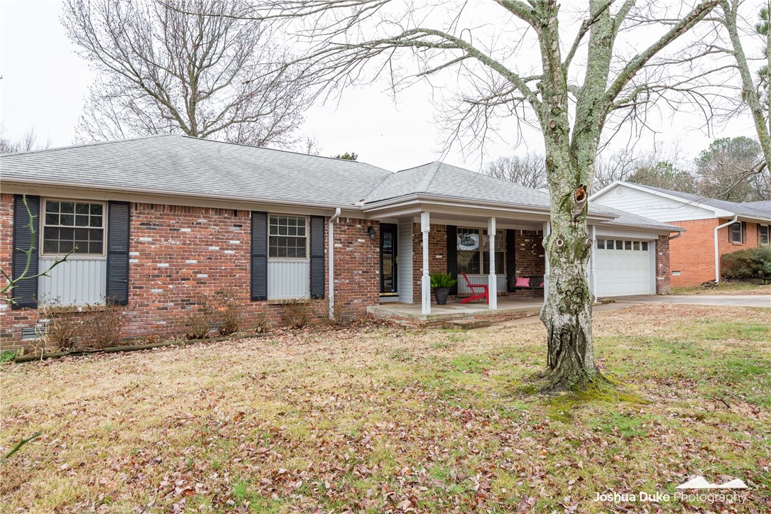You must see this wonderfully updated 3 bed 2 bath home. Located in an established East Fayetteville neighborhood, this home is close to walking/bike trails and Gulley Park as well as shops and restaurants. It boasts new tile flooring in the bathrooms and decorative yet durable COREtec vinyl plank floors everywhere else. It includes a fully updated master bath along with updates to the kitchen and guest bath. Modernized with new paint, light fixtures, ceiling fans and the addition of can lights in the living room, this home is move in ready. New to the exterior, is a porch swing, fire pit and A-frame storage building. Schedule your showing appointment now.