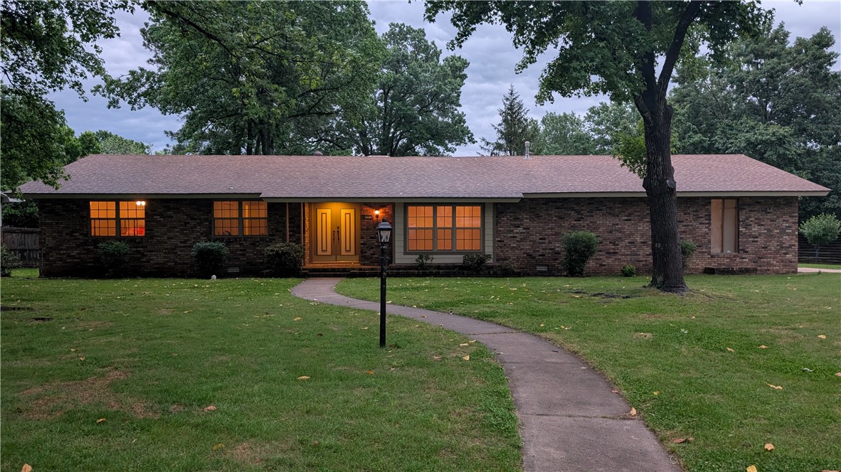 This wonderful home in the heart of Northeast Fayetteville, awaits you! The home boasts a fabulous layout with two living area, sizable bedrooms, great storage/closet space, working fireplace, two car garage, mature trees, and a beautiful yard for gardening. Double pane windows were installed and both bathrooms were updated in 2015. This is the first time the home has been on the market since it was built in 1970. Move in and modernize finishes/flooring to your tastes! The kitchen-family room would make for a fun renovation project when you are ready! It also functions quite well in its current configuration given appliances are in working order. The spacious storage room could be turned into an amazing home office! Butterfield Elementary, one of Fayetteville's most beloved PreK-4th grade schools is just a few blocks away. Imagine yourself living in this ideal location… a beautiful neighborhood, with easy access to wherever you need to go!