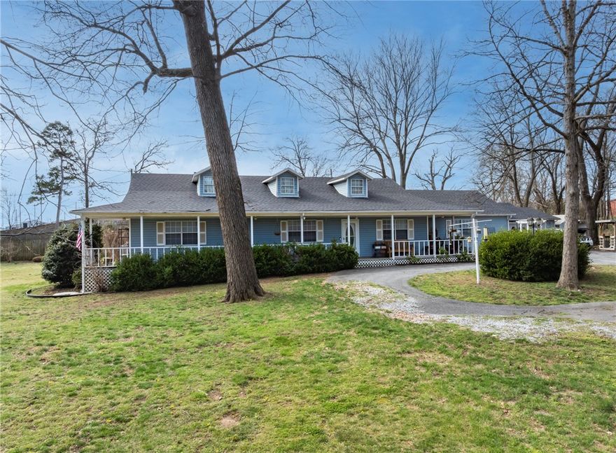 Finally, you are home. Escape the hustle and enjoy the peace of country-style living just outside the city limits with this spacious 3-bedroom, 2-bath home plus a dedicated office, on nearly an acre of beautifully maintained property.  Inside you will find two living areas perfect for entertaining. The updated kitchen features granite countertops with all appliances conveying.  A cozy wood-burning fireplace adds warmth, creating the perfect gathering spot.  Step outside and fall in love with the outdoor living space.  A 12x20 covered deck plus separate area for grilling year-round.  Property also has a two-car garage with space for hobbies and extra storage.  The fenced backyard is perfect for pets and features a greenhouse that conveys.  Major updates include new roof (2025) and HVAC (2024).  This is a must-see to truly appreciate everything it has to offer.