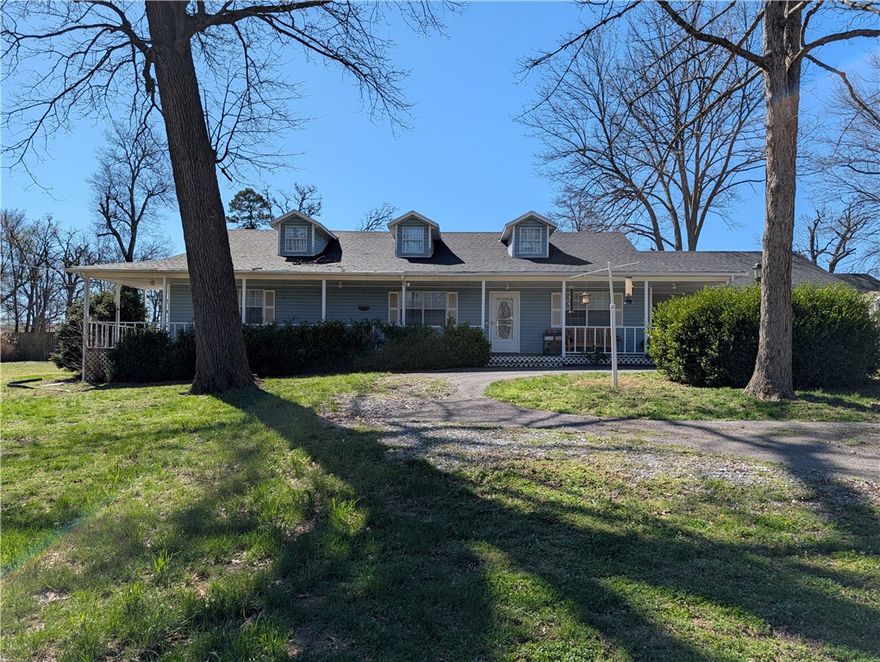 Finally, you are home.  Spacious 3 bedroom 2 bath with an office on almost an acre outside city limits.  Home features two living areas, updated kitchen with granite counter tops and a wood burning fireplace.  All appliances convey.  New roof in 2025, New HVAC 2024. Greenhouse conveys.   This is a must see to appreciate.