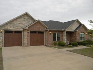 Beautiful 4 bedroom 3 full bath home in popular Overland Park subdivision in Western Russellville. This home is in mint condition and features a spacious master suite with walk-in tile shower, double vanities, and jetted tub plus an additional bedroom with on-suite full bath with shower and walk-in closet. Complete with tall ceilings, hardwood and ceramic tile flooring, custom trim, and beautiful granite counters throughout. Privacy fenced back yard with a large covered back porch that is perfect for relaxing. Come see!