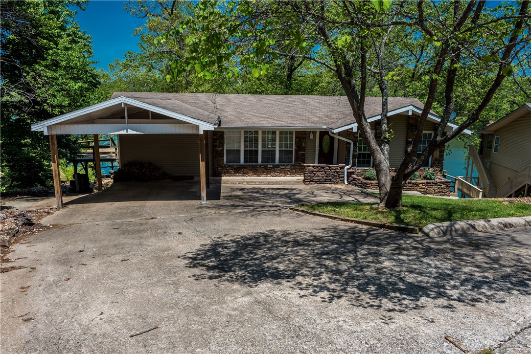 Lake Avalon Front! Bentonville schools! What else could you want? It's 3B/3Bath and easy to the water. Over 1/2 acre to enjoy and has a new dock and steps into the water. Lake Avalon is great for lake living, canoeing, fishing and kayaking. Imagine beautiful sunsets on your deck and unwinding with a glass of wine. Full suite downstairs with access to and view of the water. Don't wait to see this one - call for your private showing.