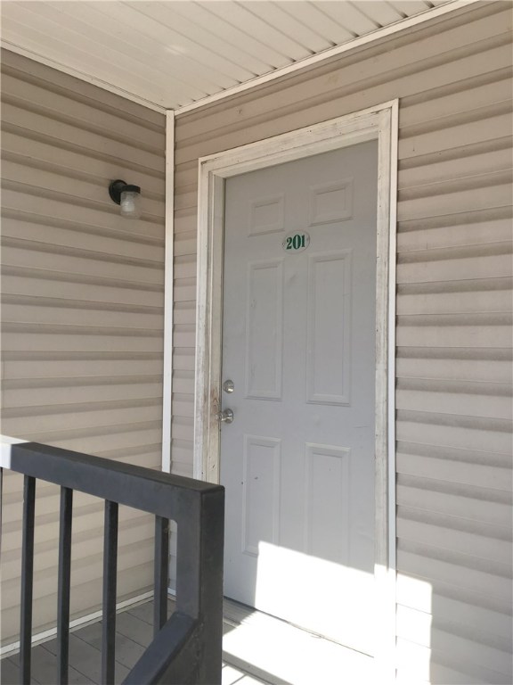 Spacious upstairs apartment, 974 SF, 2 bedrooms, 1 bath. Huge living room w/ access to balcony. Full-size refrigerator, range & garbage disposal in kitchen. Full-size washer & dryer in hall. Lawn care provided. No fence. All electric unit. New paint. Call today to preview.