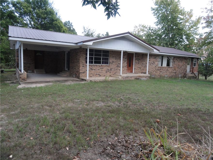 Charming 3-bed, 2.5-bath home on 1 acre in the heart of the Ozarks, just 900 feet off of a county paved road outside of Marshall, AR. The house is all-brick with a metal roof but also has an add-on with log veneer siding & metal roof. The addition is a very large bonus room that could be used as another bedroom, office, playroom, etc. Enjoy the spacious yard with large shade trees and a really nice view of the distant mountains. The property also has a carport and enough room in the back yard for a garden.  Marshall is the county seat of Searcy County and is only 6 miles away. Ideal location for nature lovers—close to Buffalo National River for horseback riding, camping, hiking, hunting, fishing, and floating. Just 45 minutes to Blanchard Springs Caverns & trout fishing.  Wal-Mart is 45 minutes away, 1 hour to Greers Ferry Lake, 1 hour to Harrison, AR, & 1.5 hours to Branson, MO. Perfect blend of peaceful country living with proximity to all the outdoor adventures you crave. Don't miss out on this lovely property!