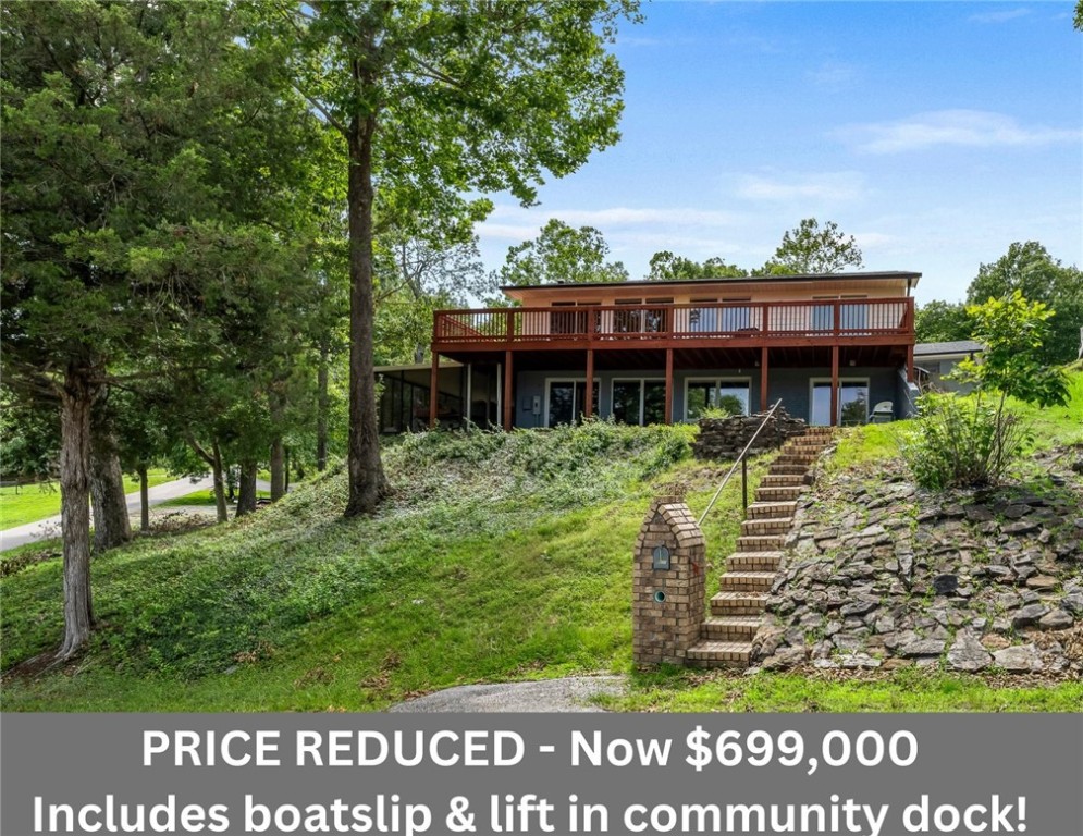 Don't miss your chance to own this stunning 3-bed, 2 full- & 2 half-bath home with Beaver Lake views throughout - INCLUDES a boat slip & lift in the community dock!
This home features an all-new open floor plan with 2,389 sq ft on two levels and includes two ensuite bedrooms (one on main level and one on lower level). Sliders and full-length windows across both levels give you seamless indoor-outdoor living onto the adjacent patio & deck spaces. Thoughtfully designed and upgraded with all new underground 200amp electrical service, all new plumbing, HVAC, roof, concrete siding and a brand new deck. GE Profile appliances, granite & quartz countertops and LVP flooring throughout. Direct access on both levels could make a great income opportunity!
An QUICK trip to YOUR lake life - Only 6 miles from Downtown Rogers!
Perfect as your full-time residence, a weekend retreat, or turnkey short-term rental. Don't miss out on this Beaver Lake gem!