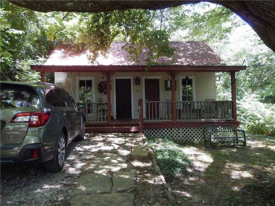 Take a gorgeous drive up to your new getaway. This cozy little cottage sits on a hill surrounded by peace and quiet. The first part of this unique cottage was built in 1880. Owner is currently using the 2nd living area as a bedroom. Updated plumbing, new appliances, gas stove in living room, eat in kitchen, stackable washer and dryer in bathroom. Home has previously been rented as an Airbnb.