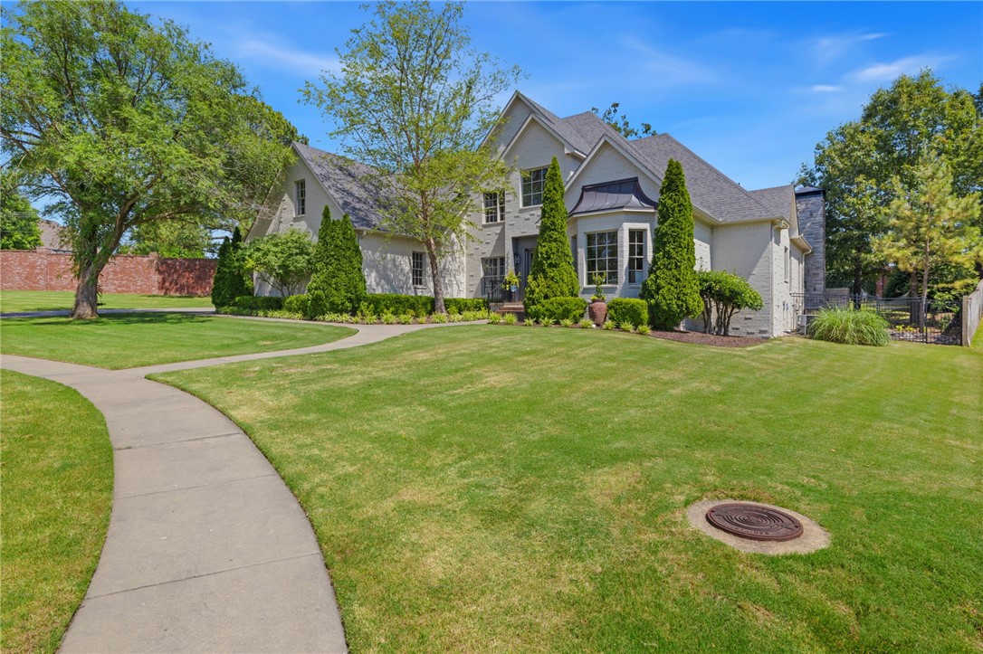 Location, Location, Location – Stunning Home in Heritage Hills Subdivision
Welcome to this beautifully updated 5-bedroom, 3.5-bathroom home located in the highly sought-after gated community of Heritage Hills. Nestled at the end of a quiet cul-de-sac, this 4,531 sq ft residence offers luxury, space, and convenience—all in one of Northwest Arkansas’ most desirable neighborhoods. Located minutes from Shiloh Schools, Tyson Headquarters, Arkansas Children’s Hospital, and easy access to I-49. Spacious and modern kitchen with a breakfast nook and large island with bar seating for 2, formal dining room and dedicated office space or parlor, main level master suite, expansive upstairs bonus/flex space, 3 additional bedrooms upstairs, plus an additional versatile large room above garage. This entire estate has been updated throughout. Outdoor living space is very peaceful and private, featuring a heated saltwater pool, outdoor shower, grilling station, beverage area, and wood-burning fireplace – perfect for entertaining.