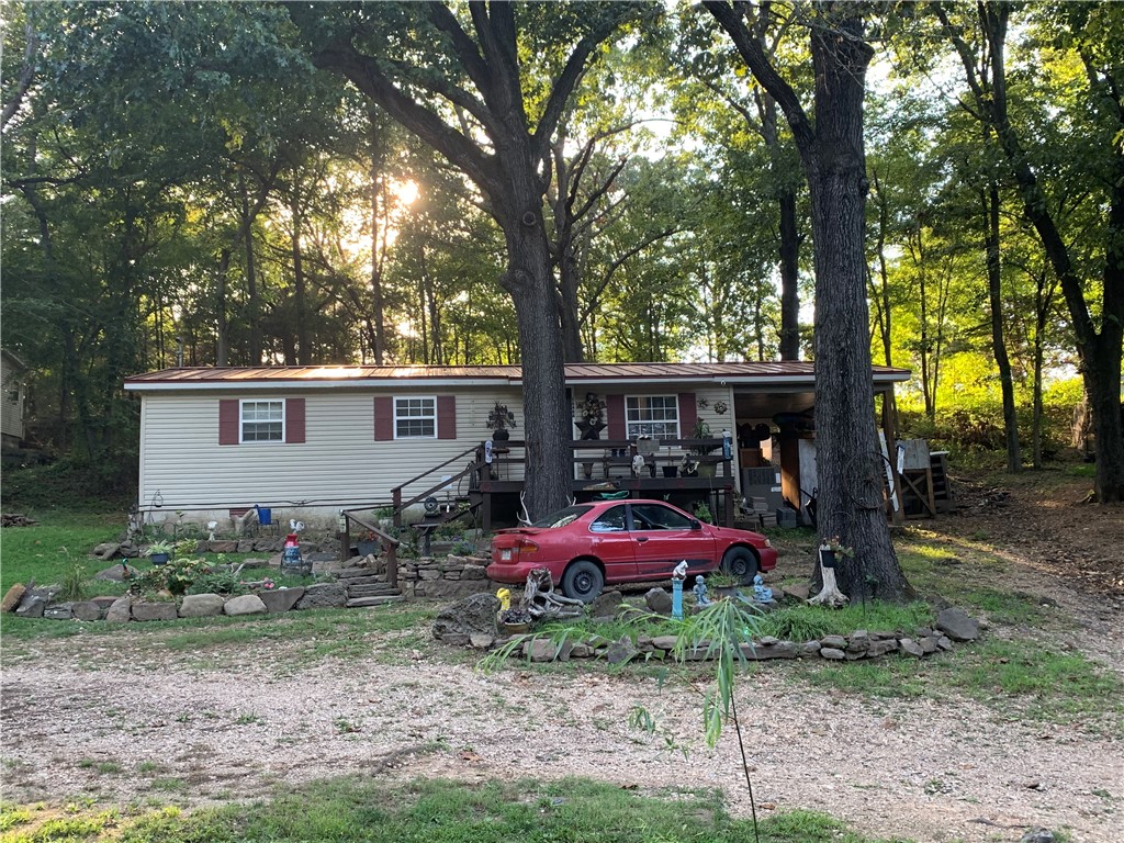 Home located near Beaver Lake. There are two lots included in the sale that total .5 acres. This would be a great starter property or rental.