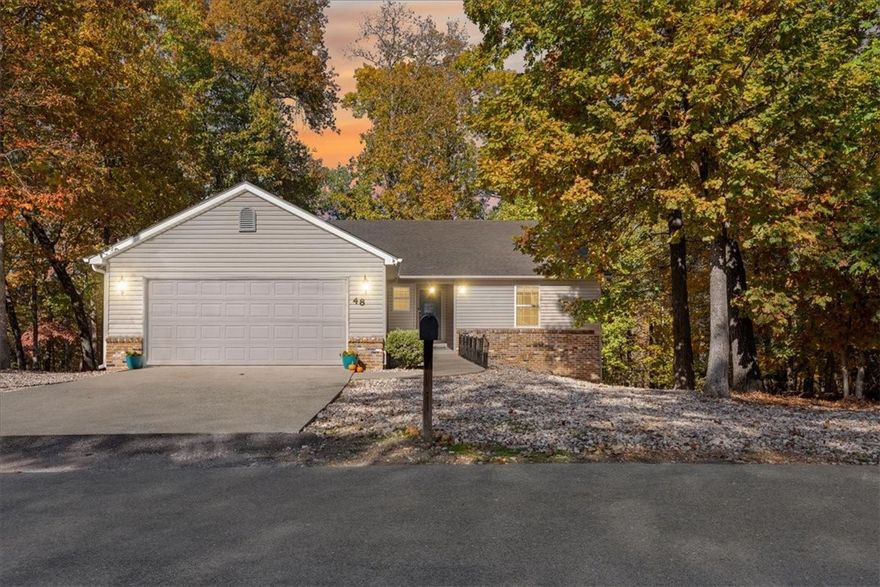 Adventure awaits right outside your front door! This move-in ready home is surrounded by the Back 40 Trail system, with a trail access point right on the street and the Back 40 running directly behind the property. Enjoy wooded views from your covered back deck and relax by the cozy gas fireplace after a day on the trails. Inside, you’ll find stylish LVP flooring and an inviting, open layout perfect for modern living. Conveniently located just minutes from Blowing Springs, Cooper Elementary, and only 7 minutes from the highly anticipated OZ Trails Bike Park opening in 2026. This is the perfect blend of comfort, convenience, and outdoor adventure. Washer, dryer, and fridge can convey with acceptable offer.