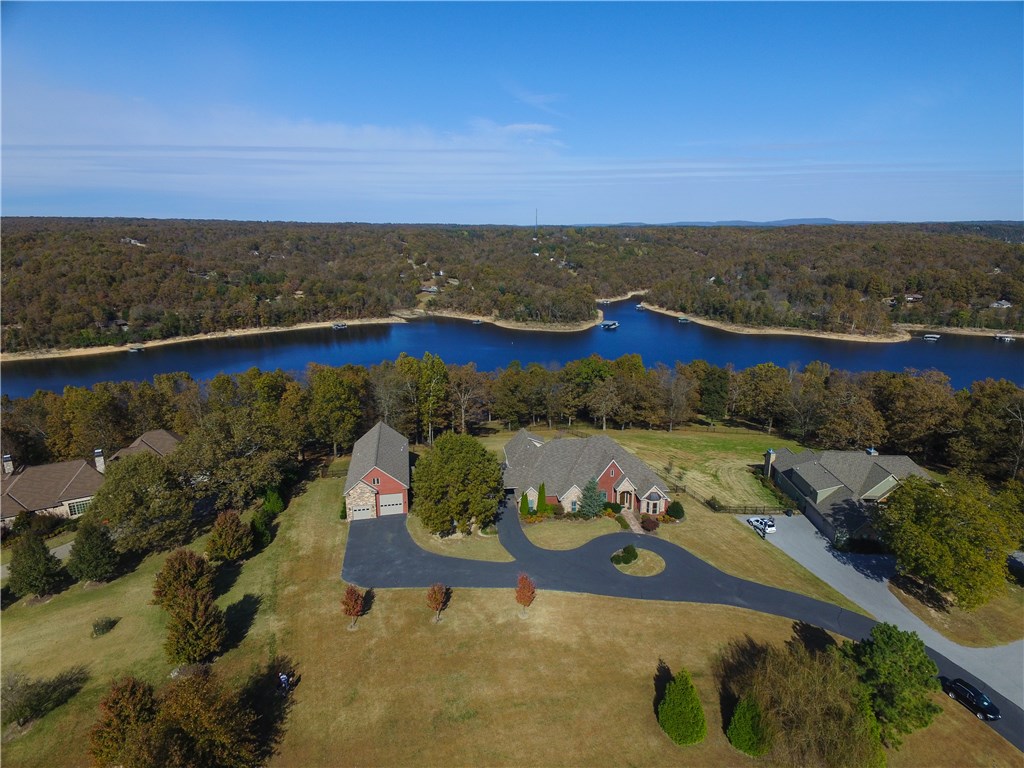 Stunning Lake Front home on 3.3 acres with private community boat dock, 5 BR, Library/Office, nice upstairs workout/Bonus room. Darling detached studio PLUS detached 1,750 square foot modern décor apartment with RV parking and garage parking. Outdoor living space with fireplace and beautiful lake view. Many amenities!!!