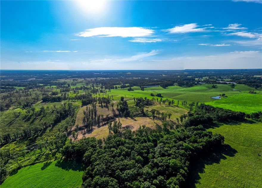 Rural beauty with stunning western views. Space to spread out on 4.5 acres that overlooks some of the prettiest countryside Arkansas has to offer. Want space to homestead but don't want to be too far from civilization? This large lot neighborhood of 4 future homes may be the answer you've been looking for. With the new 612 bypass nearing completion, access to all of NWA is minutes away. 2 lots available and one to come (4.5, 3), so pick your neighbors and bring them along. The hill leading to the main entrance will be paved in the future. Photos of entire neighborhood.