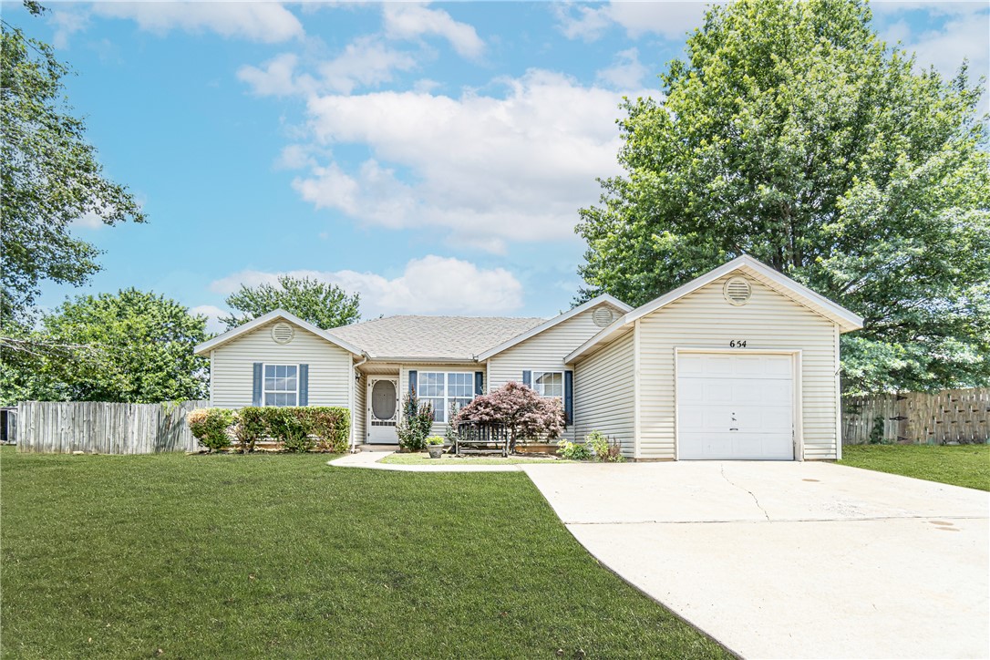 What an opportunity! Don't miss this clean, cute-as-a-button house listed under 200k and ready to make your own! This 3br/2ba 1262sqft home is conveniently located (and at the end of a cul-de-sac!), has a newer HVAC (2018), immaculate wood flooring in the dining/kitchen, a refrigerator (new) & washer/dryer that convey!, and comes with a great storage shed in the enormous back yard. Home is being sold as-is. Previous owner was a smoker -- walls have been primed and ready to paint; carpets will need to be replaced.
