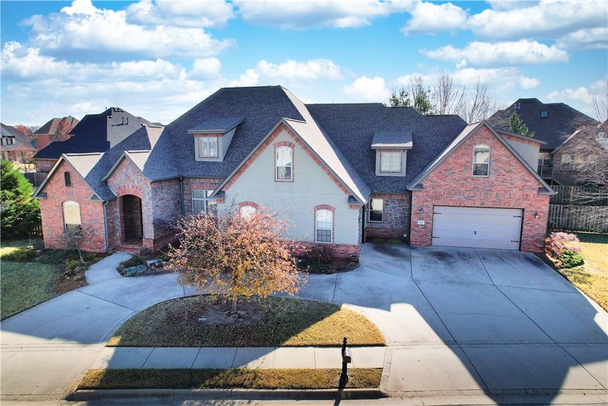 This stunning 4 or 5 bedroom home spans 3,990 square feet in prestigious gated Shadow Valley community of Rogers. This meticulously designed home offers a blend of both luxury and comfort. The spacious floor plan includes multiple living areas perfect for your family and entertaining. The kitchen features double ovens, drawer microwave, gas cooktop, and ample counter space. The large primary suite has access to the outdoor living area and a sizeable bath and walk in closet. All bedrooms have a private bath or Jack and Jill bath. The upstairs bonus room can also be a 5th bedroom with a full bath, wet bar, and closet. Enjoy lots of easily accessible attic storage for your seasonal decorations. The private outdoor living space allows year round usage and includes a wood fireplace, wood-fired pizza oven, gas grill, fridge, and TV along with an impressive area for relaxing with family and friends. Enjoy the amazing amenities of SV with your transferred social membership. Don't hesitate to see this gorgeous home!