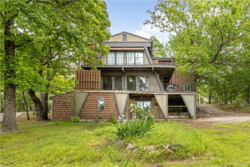 Discover this one-of-a-kind, three-level home nestled on two expansive lots in a peaceful golf course subdivision. Offering exceptional potential and space, this property is being sold as-is, providing a blank canvas for your creative vision.
Enjoy the stunning scenery from the large wrap-around decks on the upper floors—perfect for morning coffee, entertaining guests, or simply soaking in the panoramic views. The oversized lot allows for a second unit, private garden, or outdoor retreat, making it ideal for those seeking flexibility and future expansion.
Located just 13 minutes from the vibrant town of Eureka Springs, you’ll have easy access to dining, shopping, and arts and culture. For the outdoor enthusiast, Table Rock Lake is nearby, offering endless opportunities for water sports, boating, and fishing.
Whether you're looking for a weekend escape, vacation rental opportunity, or a full-time residence with character and potential—this property is a rare find in a sought-after location