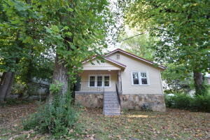 Take a look at this 2 Bedroom 1 Bath home with lots of potential. There are several windows that provide an abundance of natural light in this home which has an elevated profile on a spacious lot. Fully fenced large back yard with access drive allow for easy grocery delivery and would be quite buildable for your garage or work shop. It has an inviting front porch and new water heater.