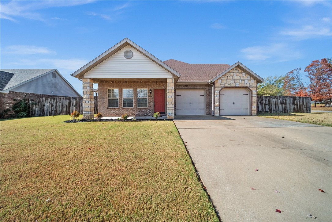 If you are looking for move in ready this is the one! This very well maintained home is on a corner lot nestled in an established quiet neighborhood between Farmington & Prairie Grove. The backyard is privacy fenced and ready for those family memories on the covered patio or around your firepit, the backyard also includes a raised garden bed for the gardener. There has been numerous upgrades during the owners occupancy including new carpet, hardwood floors, dishwasher, ceiling fans, gutters and smoke detectors. The spacious two car garage features separate doors with room for a workbench. A welcoming interior will be your families delight with three bedrooms, two baths, walk in closets, a delightful kitchen with adjacent dining area. Exterior windows are tilt-in double pane accented with wooden blinds. This home is a must see for those looking for city convenience yet with a country feel!