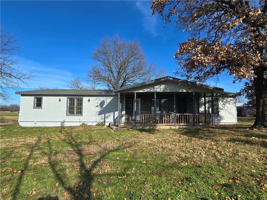 3 BR 2 BA 1,755 sq ft +/- home on 1.23 +/- acres less than a mile from Farmington schools. Half a mile to the neighborhood market, dining, fire stations, and shopping. Completely remodeled from the ground up. Roof is two years old, new plumbing, new HVAC, new 6-mil vinyl plank flooring, new fixtures & paint. Wood burning fireplace will keep it toasty. House features a detached 1,025 sq ft +/- shop/garage. Additional two vehicle covered parking. Covered deck & front porch. Property borders a little farm on two sides and is tucked away off the road. Also included is a little shed. Hickory trees & a walnut tree are an added bonus. Property also features large detached solar panels. No knowledge about the condition & how they work or if they work. Agent owned