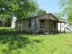 READY FOR RESTORATION-- THIS WHOPPORTUNIY is waiting! Rake in the rents with this investor special! Small cottage could be charming again with some attention and updates. Newer electrical service and breaker box. Laundry room has washer and dryer hook ups. Gas range installed. Butalso can have an electric range