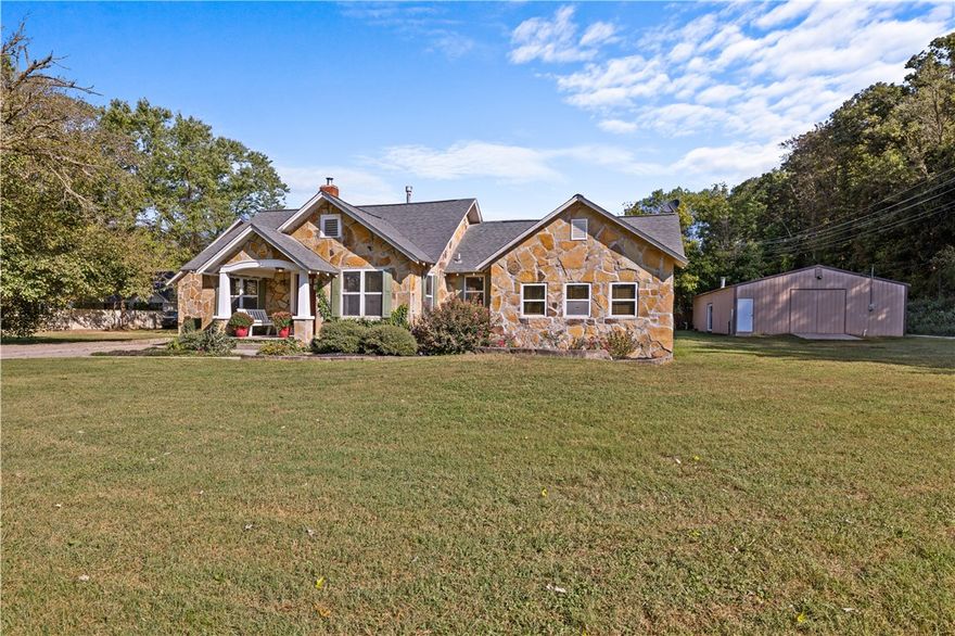 Welcome home to 10198 Sugar Creek Rd. Discover this timeless home just 5 minutes from I-49 and 8 minutes to Downtown Bentonville! This delightful property features 4 bedrooms, 3 baths, an office, and a dining area, making it perfect for family living. The property sits on the Bentonville and Pea Ridge school district which allows school choice between the two. Situated on 1.22 acres, the property features mature trees and easy access to the Big Sugar gravel bike trail right out your front door. An oversized garage offers ample storage, complete with stairs leading to the additional space. Plus, the shop building is a standout feature, offering 1,500 sq. ft. (30x50) of insulated space equipped with a wood stove, 110 and 220 wiring, on a separate electric meter. Own a piece of Bentonville where convenience meets nature!