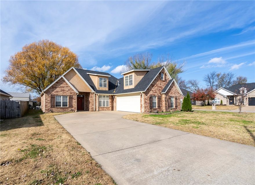 Stunning & beautifully maintained 4 Bed 2 Bath home on large corner lot close to schools, parks & downtown Siloam Springs. Step inside to an inviting living area with soaring cathedral ceilings, arched doorways, canned lighting, crown molding & cozy gas log fireplace. Kitchen offers a pantry, lazy susan & updated appliances including a new dishwasher & microwave in 2023 & gas stove in 2017. Has ceramic tile counter tops, breakfast area & formal dining. Other recent upgrades include new roof & gutters in 2025 along with new carpet, interior paint & blinds upstairs & in all bedrooms. New LVP flooring & refurbished HVAC in 2024, hot water heater, flooring & paint in primary bedroom in 2023, $20,000 primary bath remodel in 2022 that includes an amazing custom walk-in shower, ceiling fans in living & primary bedroom in 2020 & wood look ceramic tile in living area in 2019. Features an oversized garage with large storage room under stairs, walk out attic storage, keyless entry, covered patio & privacy fenced backyard,