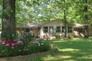 PLENTY OF PEACE AND QUIET HERE in the country, beautiful 3bd/2ba home on 4.82 Acres with fireplace and nice back deck; comes with a 2bd/1ba mobile home and storage shed. This home is featuring new water heater and AC unit, all tile floors, slab foundation and many other amenities make this house a good home for a great price. Don't let this opportunity pass! Call me today to schedule your appointment.