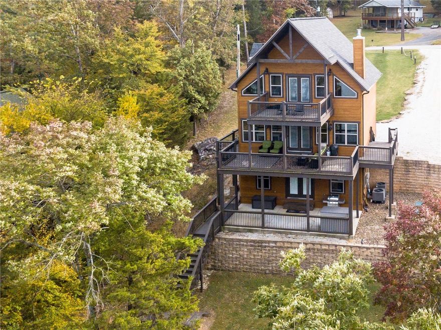 * Lakefront Home * 4 Slip Private Dock w/ Ext Swim Platform * Party Barge *

If lake life is your goal, Welcome Home! 

Mere steps from the shoreline with an abondance of windows to offer a full 180* picturesque view of Beautiful Beaver Lake. Amazing outdoor entertaining areas overlooking the lake on all three levels (3rd floor balcony, main floor surround deck and walkout patio). Modern lake cabin furnishings and stainless appliances, ALL of which convey with home. Updated water treatment system for septic. 

PRIVATE four slip boat dock with oversized swim platform, low maintenance concrete flooring, laminate plank alleyway, solar electric power, two heavy duty rollup ladders, lift and dock locker, all convey as well.

2012 Sun Tracker Regency Tri-toon Party Barge 250 XPS w/ 200 hp Mercury Optimax motor, recently serviced and currently winterized on land, as well as Bottoms Up Lift to convey.

This Gorgeous Home and Private Dock are move in ready with great lake memories to be made!