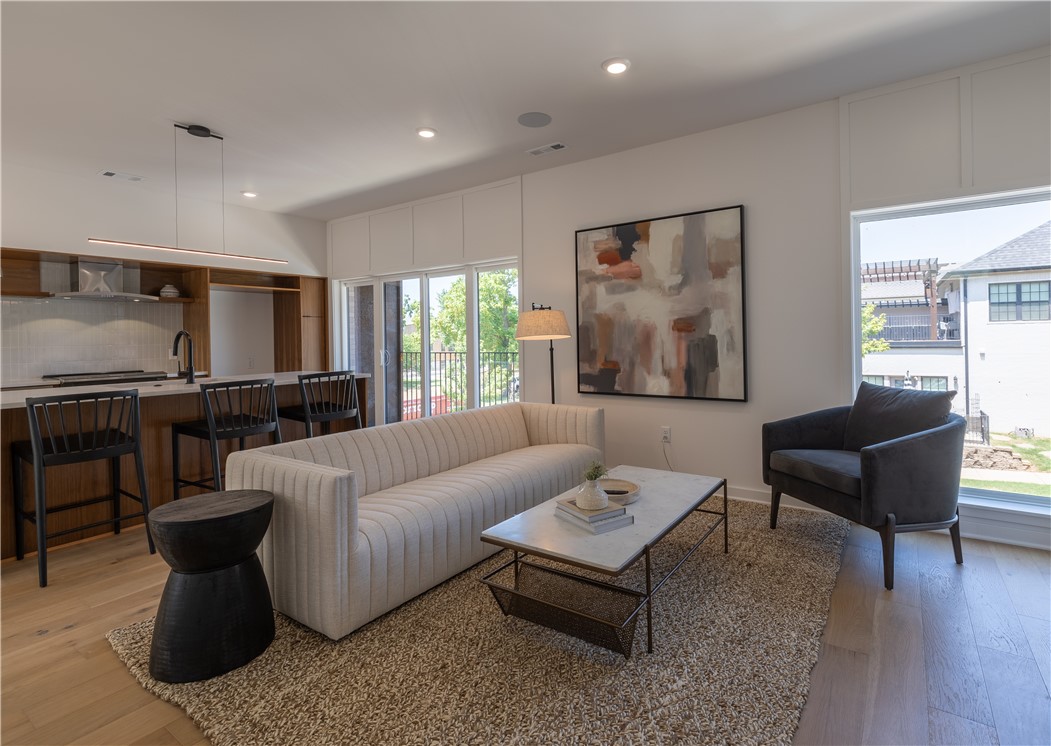 Exquisite 2 bedroom 2.5 bathroom condo with a bonus room in the heart of downtown Bentonville! Walking distance from The Momentary, Bentonville Square, Crystal Bridges, future Walmart Campus, and local favorites. Condo features custom built walnut kitchen cabinets, quartz countertops, Sonos speakers, and oversized windows flooded with natural light. Thoughtfully designed open concept floor plan with construction scheduled to finish early September.