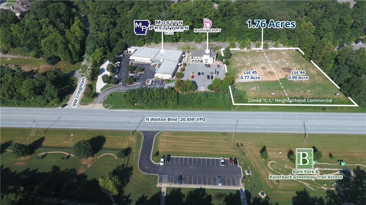 Two commercial lots totaling 1.76 acres adjacent to the Bentonville Bark Park and Razorback Greenway on N Walton Blvd in Bentonville, AR