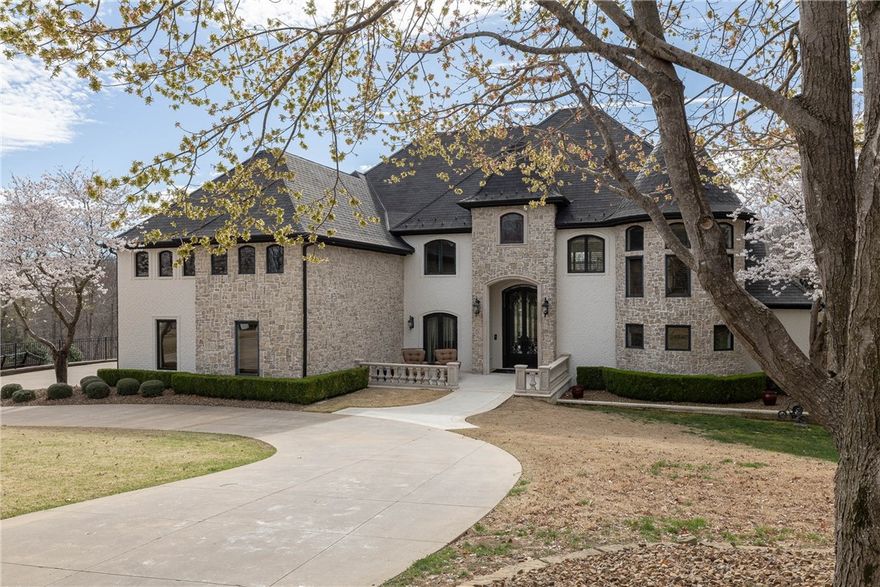 Located in the prestigious gated Blessings golf community of Clear Creek, this extraordinary 5-bed home with 6 full baths & 2 half baths has been completely transformed from the studs up—every detail thoughtfully curated for luxury, comfort, & entertainment. Inside, soaring spaces unfold with custom cabinetry, quartzite surfaces, rich wood flooring, & high-end appliances designed to impress even the most discerning chef. Accordion doors invite the outdoors in, opening to a resort-style patio with built-in grill, warmer, & a heated infinity pool with dual swim jets, surrounded by lush landscaping & outdoor audio. The spa-like main-level suite offers a fireplace, soaking tub, & quartzite vanities. Each bedroom is a private en-suite with custom finishes, including a second-level retreat with soaking tub. Additional living spaces include a two-story office, Football Room with cigar lounge, bar & wall of TVs, plus a home gym, media room, bonus room & poolside kitchenette—every inch designed for refined, relaxed living.