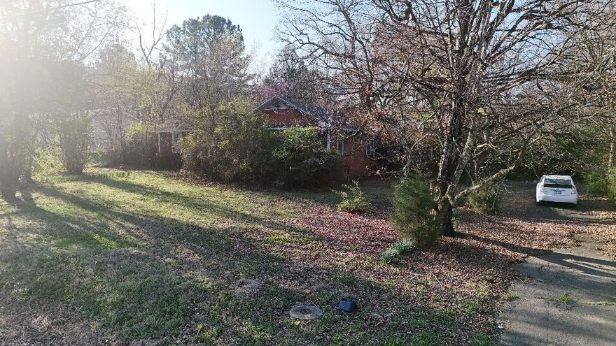 Investor & builder opportunity in a prime Fayetteville location! This 0.55-acre in-city lot offers excellent potential for redevelopment or new construction. The existing 1951 structure is being sold as-is. Detached garage, asphalt driveway, 3-side fencing, and utilities available, including electric, gas, and public water. Near parks, schools, walking & biking trails, hospital, and major corridors. Also listed as Land MLS #1340238. Buyer to verify all intended use with city. Buyer to verify land/lot loan terms with lender.