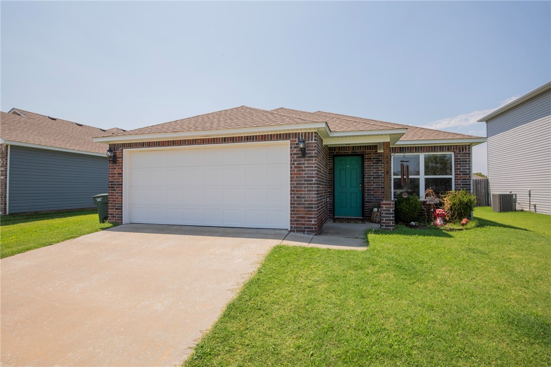 Here's an exceptionally located home just 4 miles the U of A campus and directly butting up to the trail system. This makes for a perfect home for someone wanting to downsize, begin their home ownership journey, have a place to live in your college years, or have a turn key rental for an investor. Low maintenance fence back yard too! Open kitchen to living room floor plan. Hard surface flooring in living, halls, kitchen, and bathrooms. Don't delay, book your showing today!