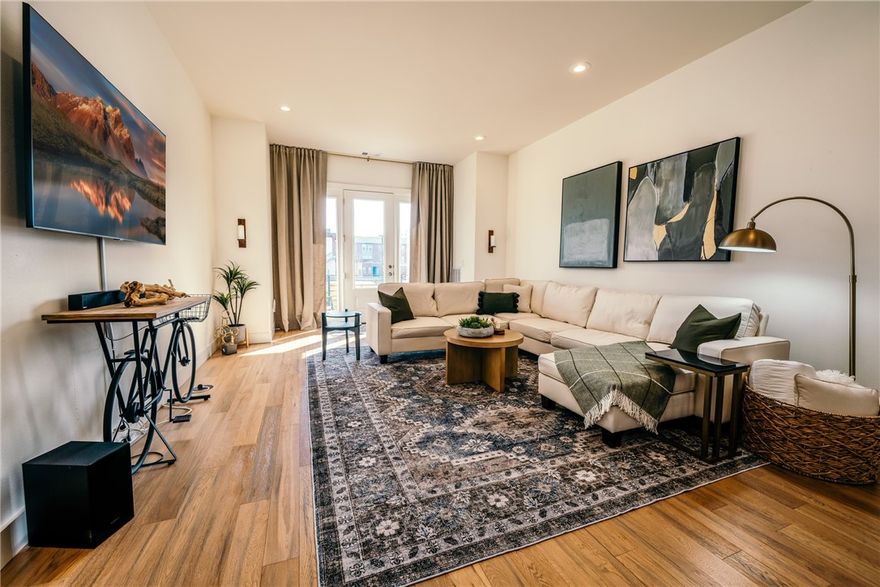 Introducing "Hub Life" – an exquisite townhome in the heart of Downtown Bentonville. Nestled between Pedaler's Pub, The Hub, and Skylight Cinema, this residence offers a unique opportunity to immerse yourself in downtown living and scenic trails. The first floor will welcome you with a generously sized bedroom and bathroom. An attached garage provides parking and dedicated space for bike storage. On the second floor, you'll discover an open-concept with a fully equipped kitchen, a chic living room, and a designated workspace creating a harmonious blend of functionality and comfort. The third floor features the primary bedroom, boasting a cozy window seat and an en-suite spa-like bathroom. For those seeking a turn-key investment, this townhome is being offered fully furnished. The unparalleled luxury and convenience of this townhome presents an exceptional opportunity for an investment property or embracing downtown living.