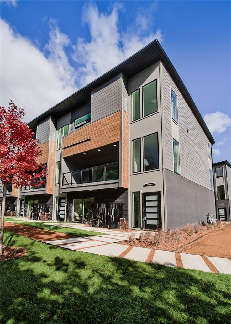 WELCOME TO DISTRICT 9/A! 30 year fixed rate financing available! Modern living located across the street from Airship Coffee! Situated near the Crystal Bridges trail and the downtown square, this brand-new back corner unit offers both convenience and contemporary design. The property includes an attached 2-car garage and a community bike wash station, perfect for outdoor enthusiasts. Additional neighborhood amenities feature an outdoor grill and a fire pit, ideal for social gatherings. The contemporary kitchen is a highlight, featuring European cabinetry, exquisite quartz countertops, and a waterfall island. With modern fixtures and custom finishes throughout, this condo exemplifies quality. Enjoy the elegance of glass balconies and the comfort of 3 luxurious bedrooms. The condo also includes 3.5 baths, designed with style and functionality in mind. Experience the ultimate luxury lifestyle with this exceptional property. Additional units are available.