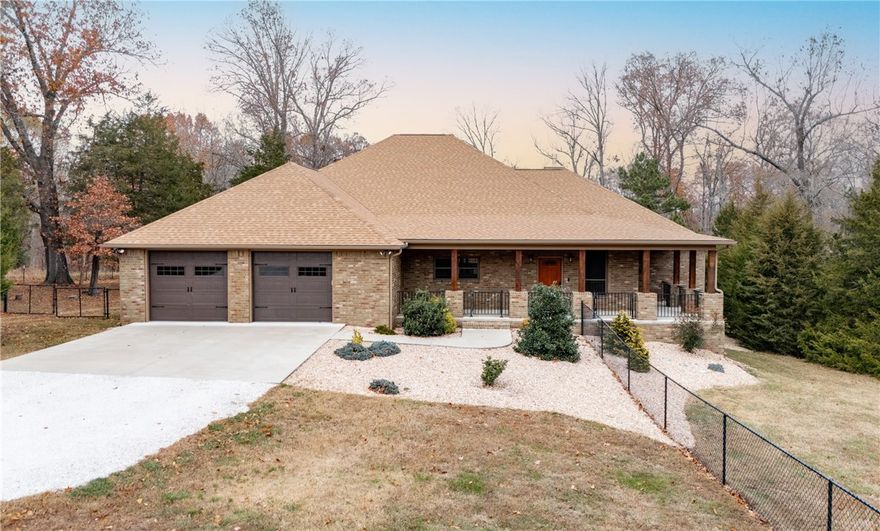 The impossible find! Tucked right between Beaver Lake and Downtown Rogers, this immaculate custom-built 2,800 sf home is packed with high-end finishes, appliances and thoughtful details. It features a whole-home generator, highly energy efficient tankless water heater, and a dual-fuel Lennox HVAC system for year round comfort. Custom cabinets throughout with an office, dedicated laundry and a separate mud room. The property also includes a  24x36 detached 3-car garage/shop, fully finished and ready for your projects or extra storage. With most of the acreage fenced, it’s perfect for most any animals you could want. A truly unique property offering both luxury and functionality in a very private setting.