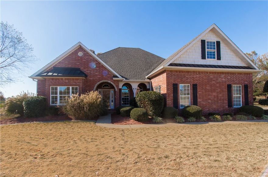 Charming 5 acre, gated estate with aaaall the bells and whistles--large, custom built home, pool, guesthouse, and barn--tucked away on a horseshoe just one mile from the 112 / 412 intersection.  If you have been looking for a home with plenty of space for your family's needs and enough land for a hobby farm with a garden and a couple horses, look no further!  Entertainer's dream with a well equipped kitchen and several spaces for entertaining from the hearth room to the game room to the bar which flows out to the sun porch and the pool deck.  If you tire of the fun and sun, retreat with your family upstairs to enjoy a movie in the media room. Beautiful, flat lot! All brick, built to last and lovingly maintained with the roof, pool liner, and several windows all replaced within the last three and a half years.  Call agent or see amenities sheet for more info!