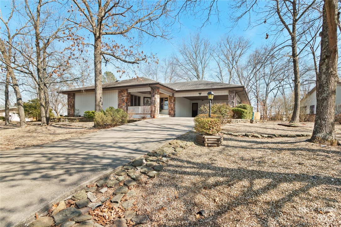 Beautiful Bella Vista Home with many updates, a level back yard including garden space and a storage shed! Includes 3 bedrooms and a large sunroom that would make a nice home office or bonus room. Open living and dining area with native stone fireplace, updated paint inside and out. Kitchen has new countertops, paint, sink and more! Workshop off carport makes for extra storage. Septic tank was also replaced in 2020. Great location close to biking, golf and all Bella Vista & NW Arkansas has to offer!
See attachment for list of updates