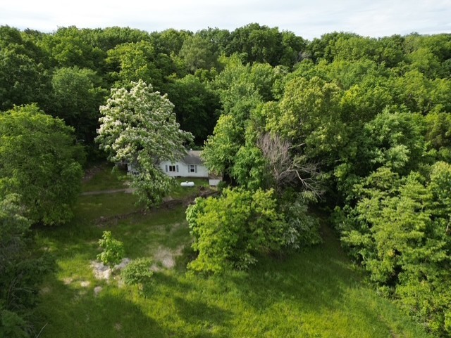 Discover the potential of this beautiful 6-acre property, perfectly tucked just off the highway for easy access while maintaining a peaceful, private feel. Mostly wooded with mature trees, this land offers a serene natural setting and multiple potential building sites ideal for your dream home or investment opportunity. Included on the property are an old farmhouse and barns—full of rustic charm and possibilities for restoration or repurposing. Whether you're looking for a place to build, explore, or invest, this property brings together location, character, and versatility in one scenic package.