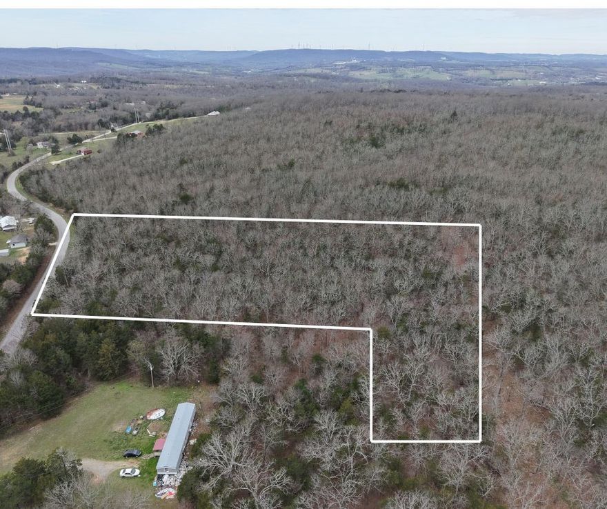 This 7.5-acre tract off Dunkard Rd offers a beautiful wooded setting with several potential homesite locations and rural water available. The gently rolling terrain provides privacy while still being manageable and easy to build on, making it ideal for a permanent residence or a weekend getaway. Located in the Alpena School District and just minutes from Long Creek, you can enjoy quiet country living while remaining conveniently close to all the shopping and amenities in the Harrison ar,  No single wide mobile homes.