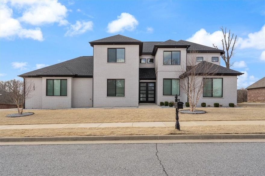 Experience the best of Bentonville living in this beautifully designed home, perfectly situated near all the city has to offer. Featuring hardwood floors throughout (with tile in water areas), this home combines style, comfort, and thoughtful convenience. The main level boasts a spacious primary suite, dedicated office, self-contained bedroom, half bath, storm shelter, kitchen with quartz countertops, oversized pantry, laundry room, and 2 dishwashers plus double ovens for effortless entertaining. Upstairs, you'll find 3 additional bedrooms, two full bathrooms, and a large game or entertainment room ideal for family fun or hosting guests. Enjoy direct access from your backyard to the bike path, with Coler Mountain Bike Preserve just a short walk away. The community offers fantastic amenities including a swimming pool, play area, and friendly neighbors. In-ground sprinklers make lawn care easy, while every detail of the home has been meticulously designed with convenience and modern living in mind.