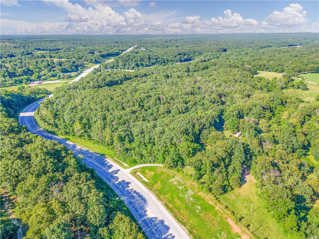 Attention Investors, Business Owners and Home Owners! Are you looking for that perfect property for your business or dream home. This property is appealing to all. Quick access to anywhere. The Average Daily Traffic ADT is 13,000(2023) and steadily increasing every year. With over 1000 feet of Highway 62 Frontage, it is Prime time to capitalize on this location.