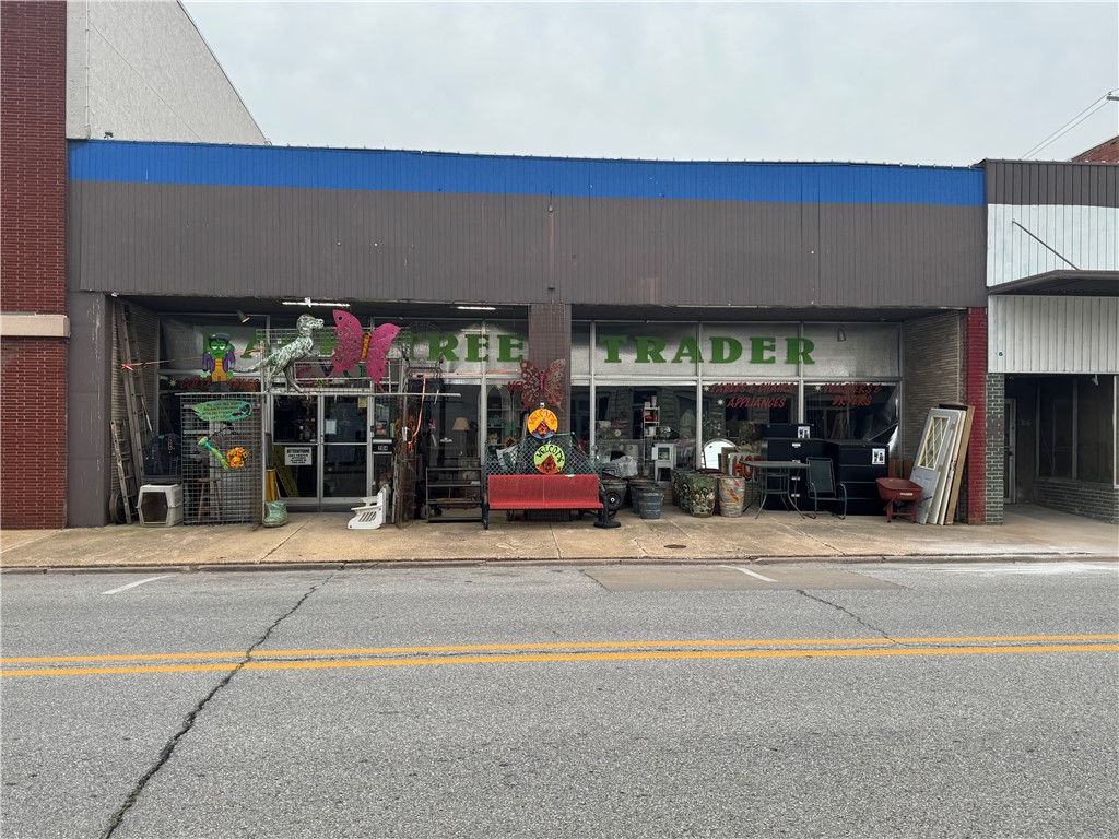 Here is your chance to own a part of Historic Downtown Harrison. Located on the Harrison Square this high visibility commercial property sits on one of the busiest streets in the area. Featuring expansive storefront windows that command presence perfect for attracting both foot and vehicle traffic. A nearby traffic signal naturally slows passing cars, providing ideal exposure. Whether you're launching a retail storefront, boutique, office, or showroom this location offers a unique opportunity to maximize visibility and customer engagement.