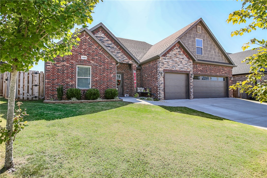 Step into comfort and style with this beautifully designed 5-bedroom, 3-bath home in one of the area's most sought-after neighborhoods. The open-concept layout is both functional and inviting, featuring two rare main-level bedrooms—including a serene primary suite with a spa-inspired bath, complete with dual vanities, a jetted tub, tiled walk-in shower, and an oversized walk-in closet that conveniently connects to the laundry room. The kitchen offers a spacious island, granite countertops, stainless steel appliances, gas range, and walk-in pantry—all flowing seamlessly into a cozy living area with a gas fireplace. Upstairs, you'll find a versatile bonus space or fifth bedroom, plus two additional bedrooms, a full bath, and generous walk-in storage. Outside, enjoy a fully fenced backyard with an extended patio and covered area ideal for entertaining. Located within Bentonville Schools and close to community perks like a pool and separate dog parks, this home checks every box for modern, comfortable living.