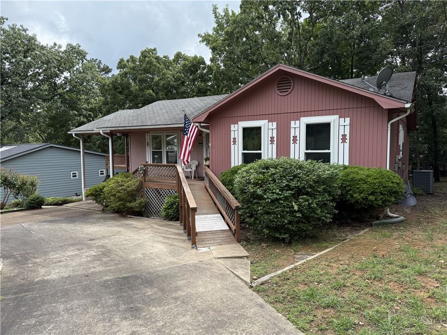Welcome to this 4 bedroom, 2 bath home offering 1,816 sq ft of living space in the desirable lake community of Fairfield Bay near Greers Ferry Lake. This property features a 1-car carport, convenient circle drive, and a spacious layout perfect for full-time living or a weekend retreat. The basement includes a workshop with outside access only, along with additional storage space. Fairfield Bay offers  golf, pools, mini golf, hiking and biking trails, 90+ miles of ATV trails, and the top-rated Fairfield Bay Marina on Greers Ferry Lake. Great opportunity to live near the lake!
