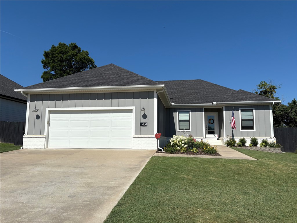 Don't miss this beautifully maintained 4-bedroom, 2-bathroom home built in 2019 in a great location. Step inside to discover a spacious open-concept living area featuring vinyl flooring and shiplap fireplace. The inviting living room is highlighted by a light and airy color palette. The stylish kitchen boasts soft gray cabinetry, granite countertops, a subway tile backsplash, stainless steel appliances, and a striking blue island, alongside an eat-in dining area. Unwind in the private primary suite, complete with recessed lighting, vinyl floors, a walk-in closet, and a luxurious ensuite bathroom featuring a double vanity and a walk-in shower. Three additional bedrooms and a full guest bath provide plenty of space for family or guests. Enjoy outdoor living with this awesome fenced in backyard retreat!